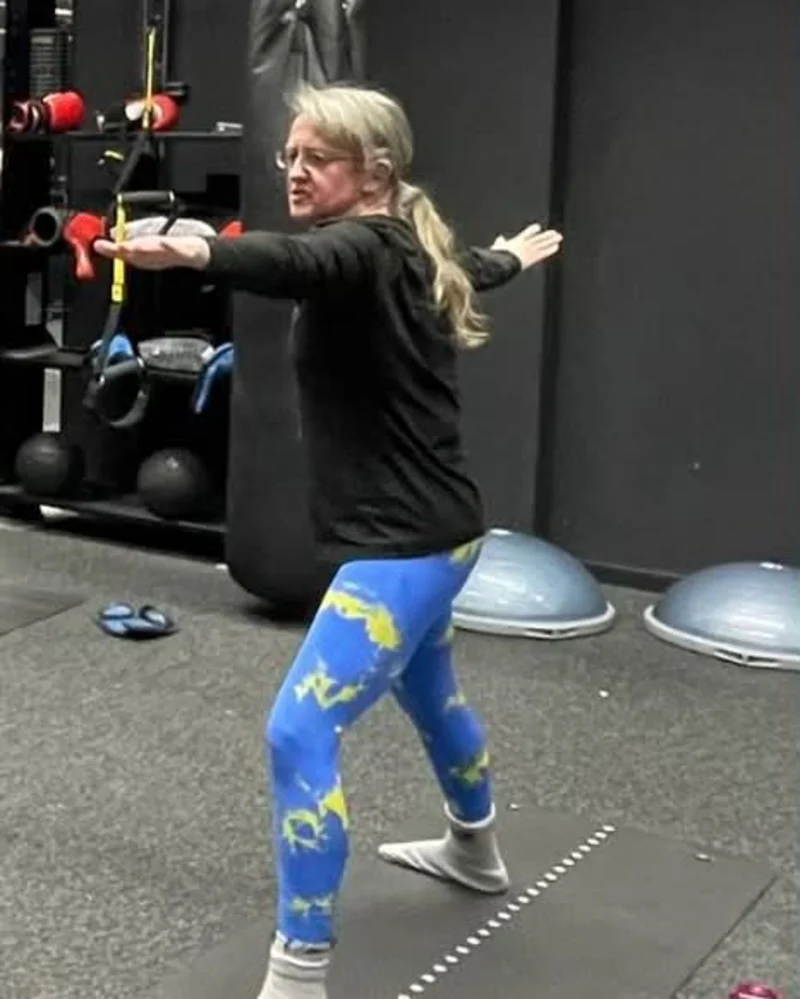 A standing balance and stretch exercise during a class session