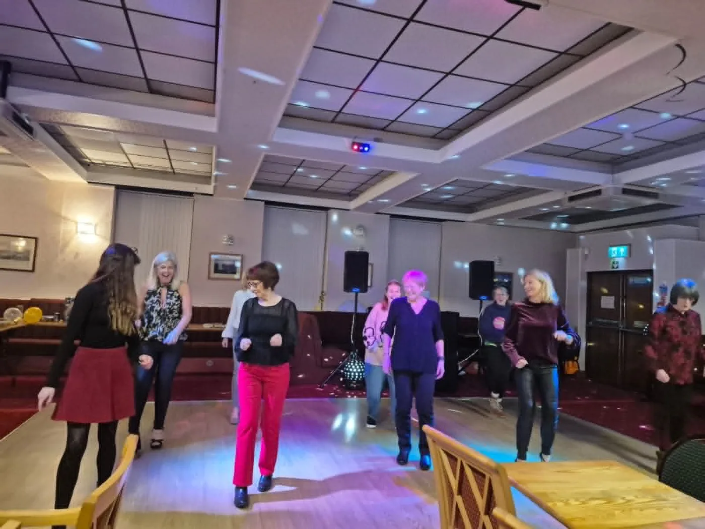 A friendly line dance class in full swing