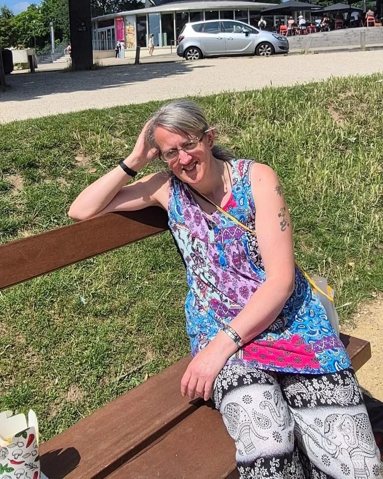 Anne relaxing outdoors on a sunny day while travelling